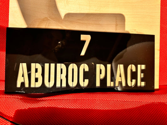 House sign with letters cut out