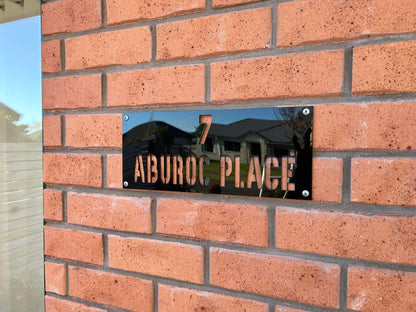 House sign with letters cut out