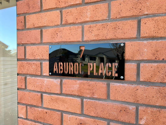 House sign with letters cut out